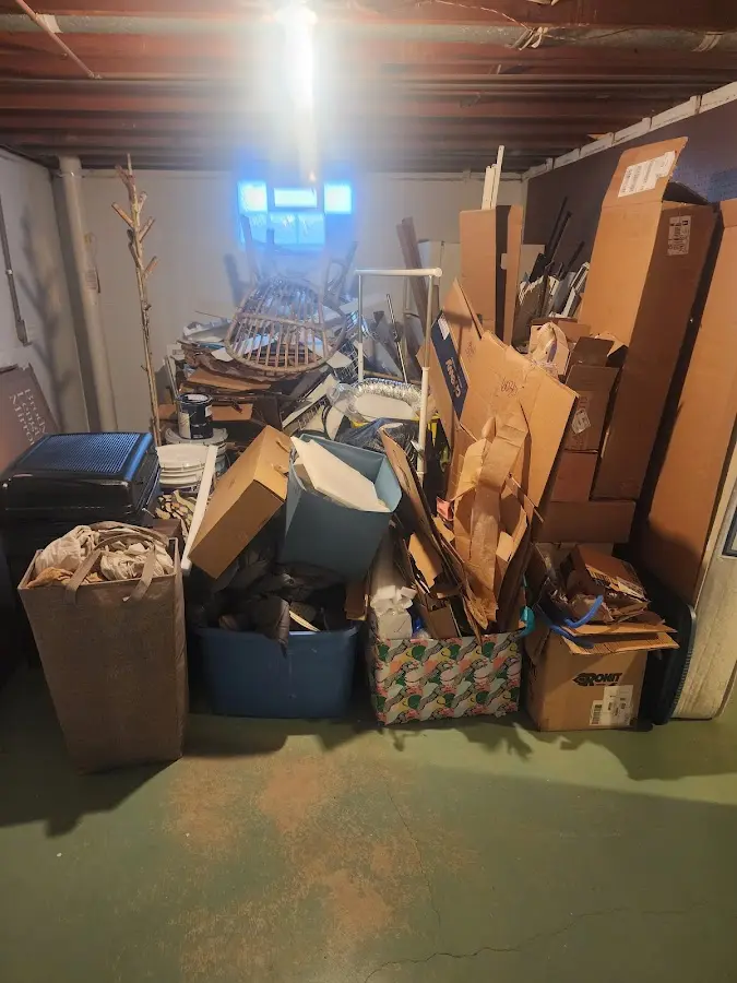 Roll-off dumpster container at job site for 2 Yard Dumpster Rental in Ammon